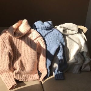 Three small banana republic sweaters.